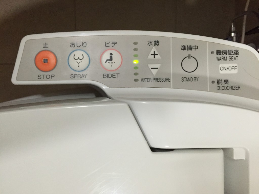 Interesting toilet buttons on a Japanese Toilet