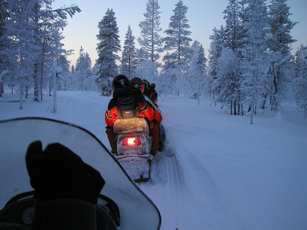Driving a snowmobile in Saariselkä, Lapland, Finland